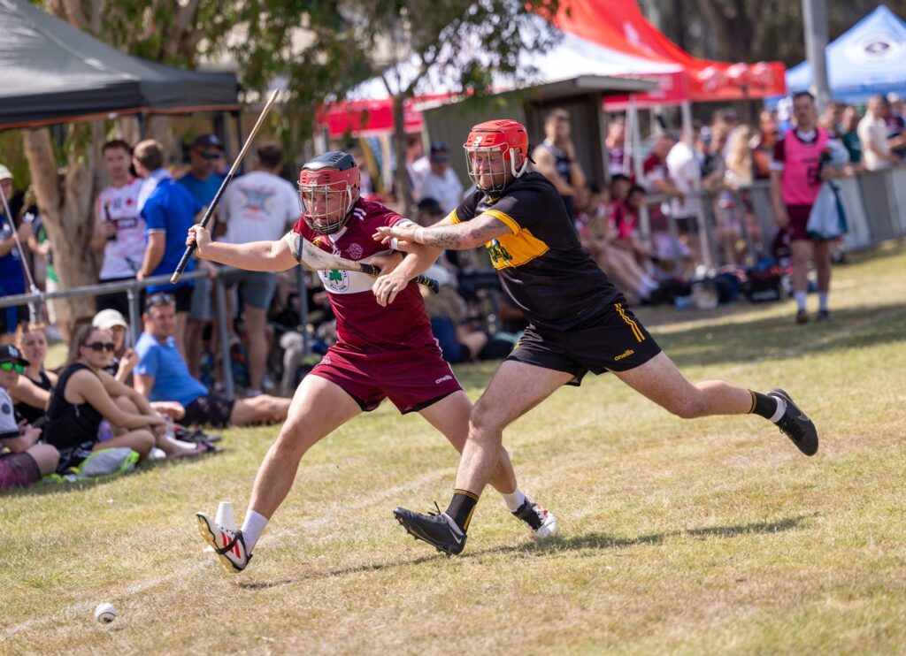 Queensland and Western Australia hurlers in action at the 2025 Australasia Championships.