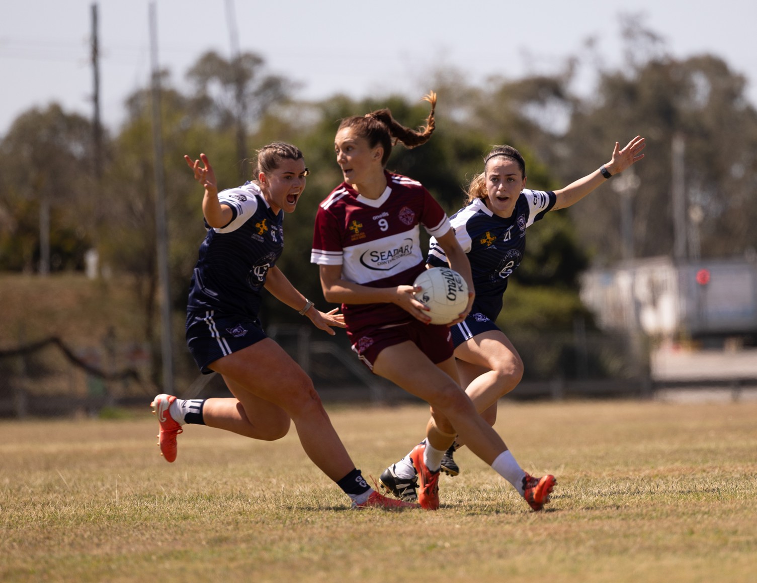 Queensland and Victoria senior women's footballers at the 2025 Australasia Championships in Brisbane.