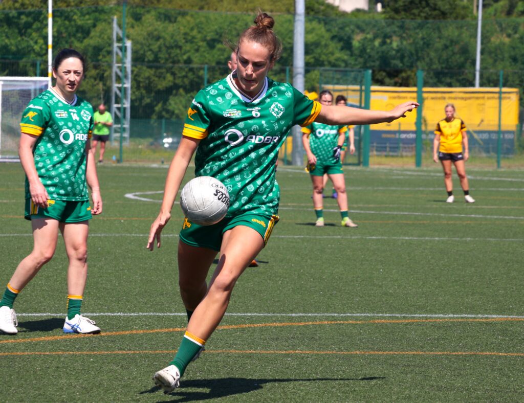 Australasia's Olivia Bramley kicking a point against Middle East at the 2026 GAA World Games.
