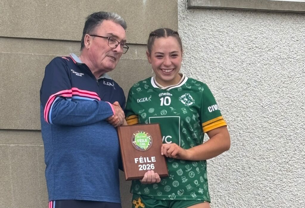 Australasia Féile Peile na nÓg captain Maya Bloomfield receiving the plate trophy.